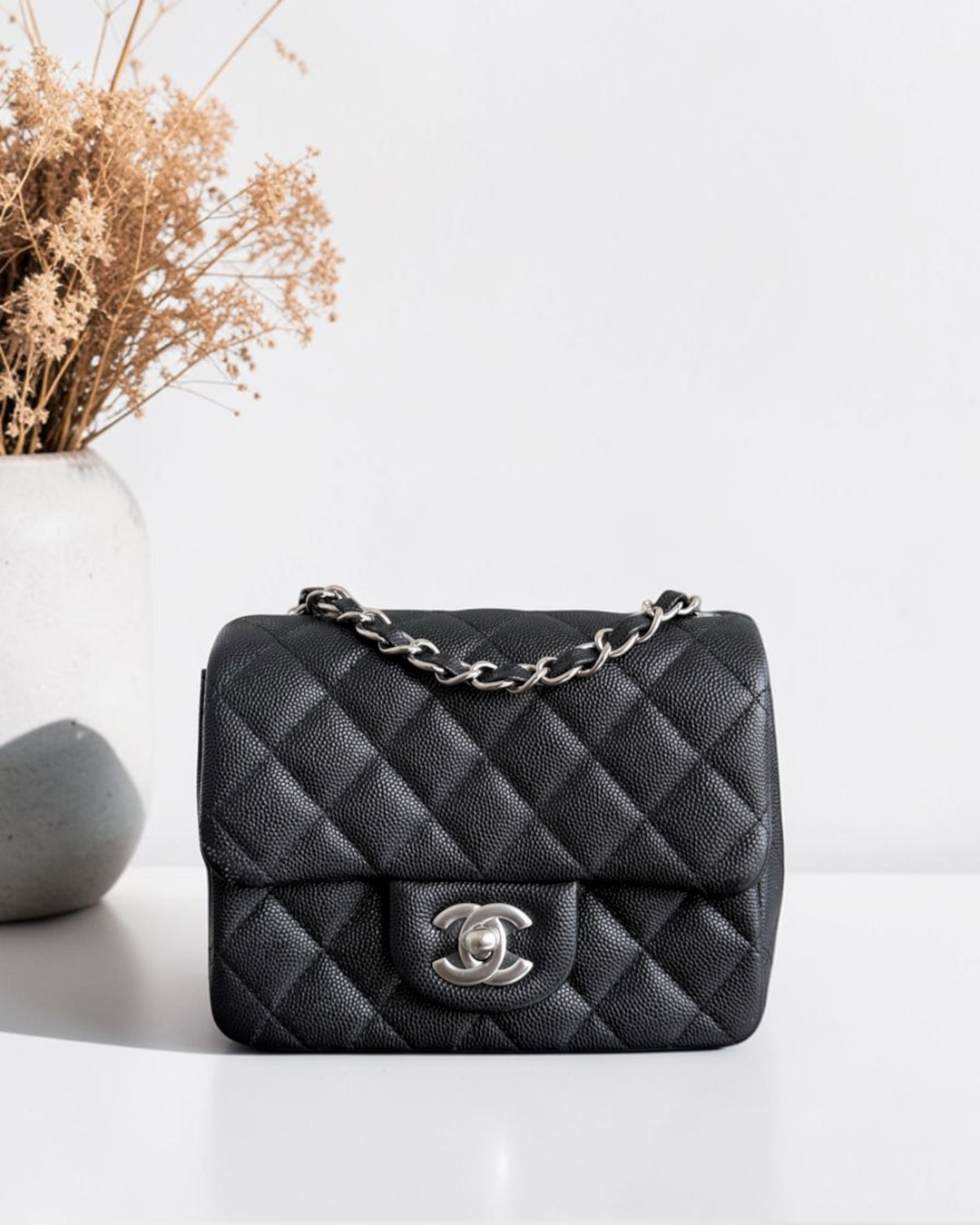 Luxury Evermore black quilted caviar leather Chanel classic flap bag with silver-tone hardware and chain strap