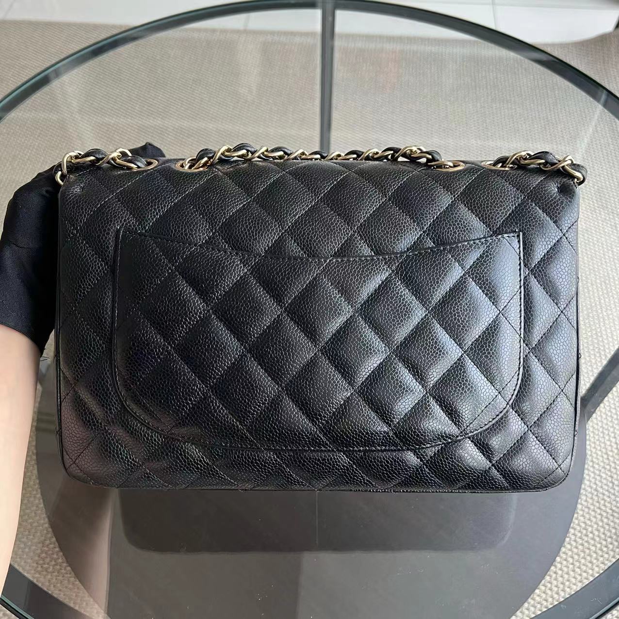 Chanel Classic Caviar Jumbo Classic Flap Quilted Grained Calfskin Black Golden Hardware Series 12