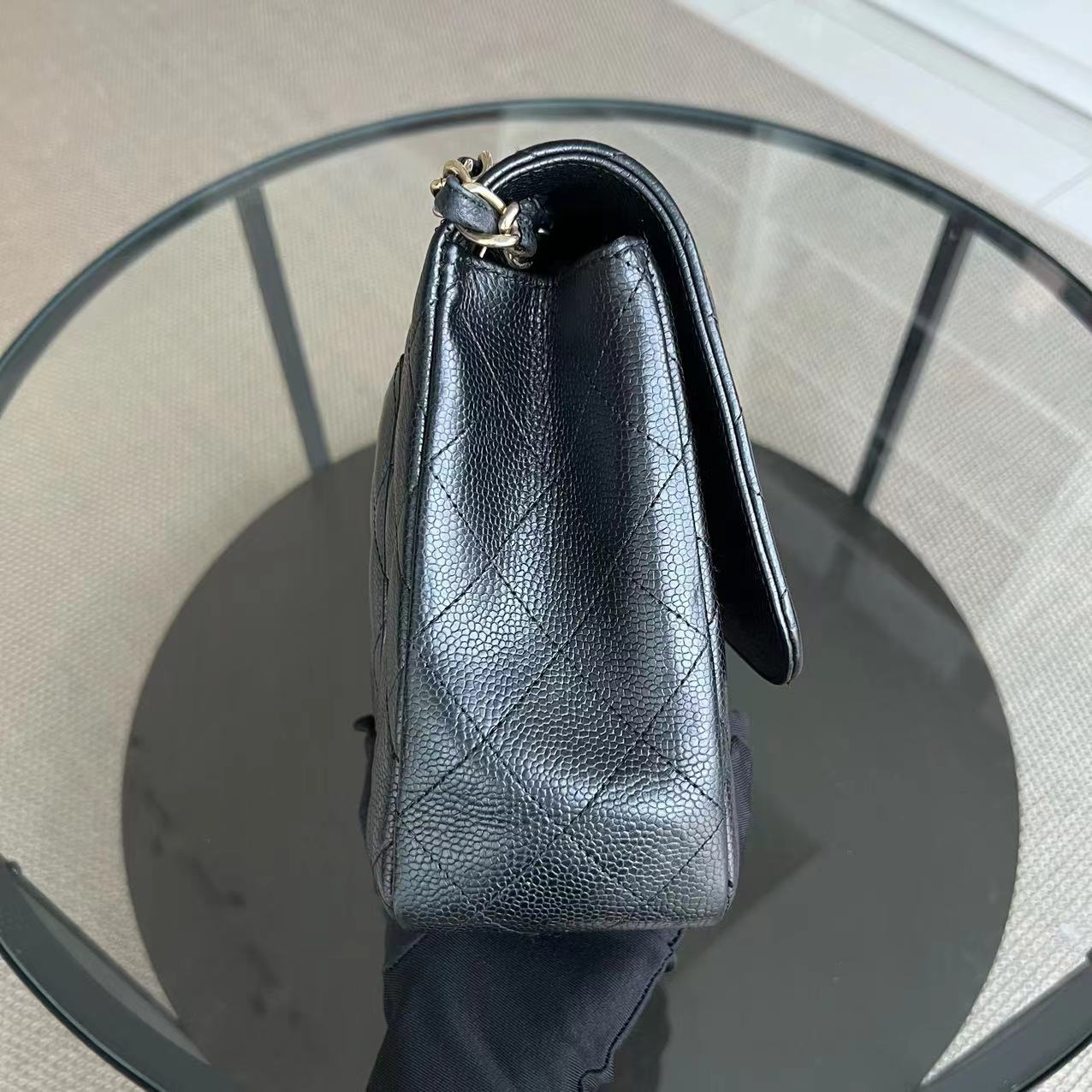 Chanel Classic Caviar Jumbo Classic Flap Quilted Grained Calfskin Black Golden Hardware Series 12