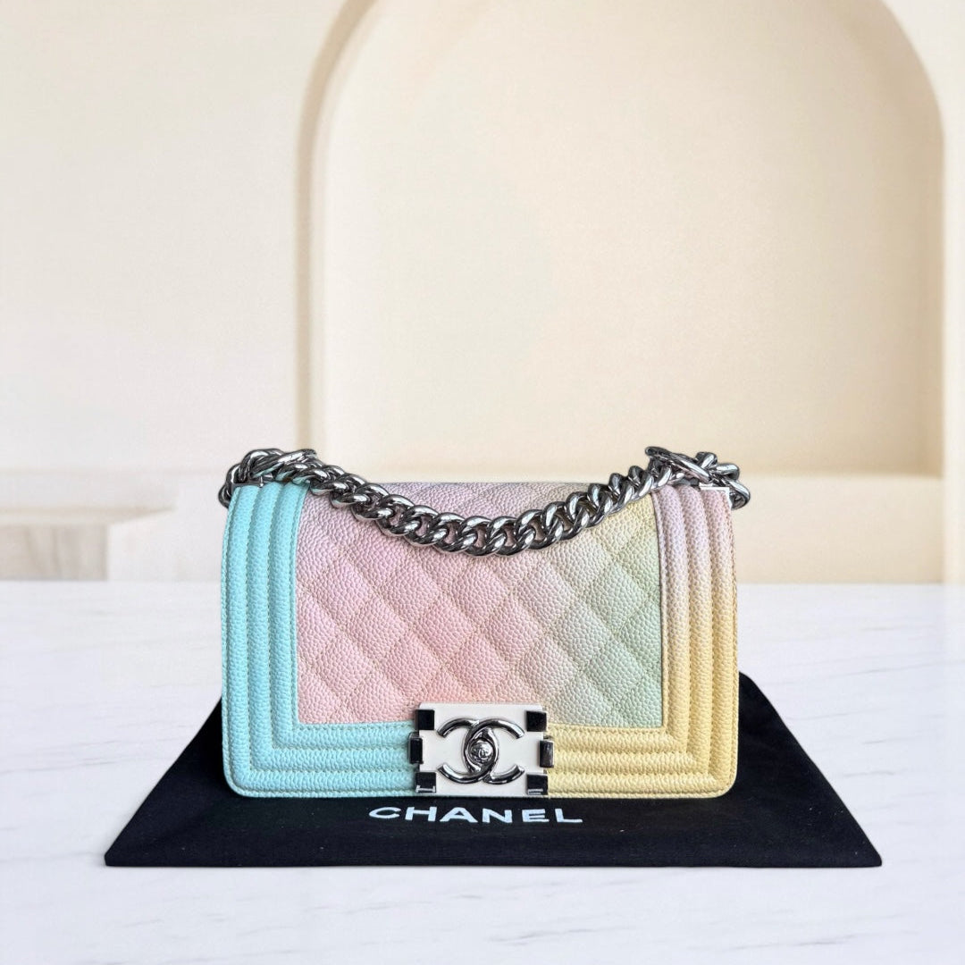 Multicolored quilted handbag with Chanel logo on a white surface