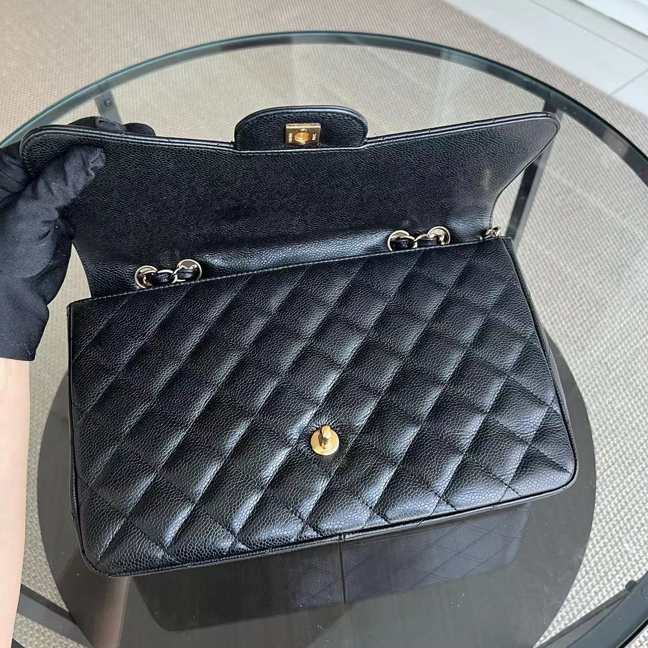 Chanel Classic Caviar Jumbo Classic Flap Quilted Grained Calfskin Black Golden Hardware Series 12