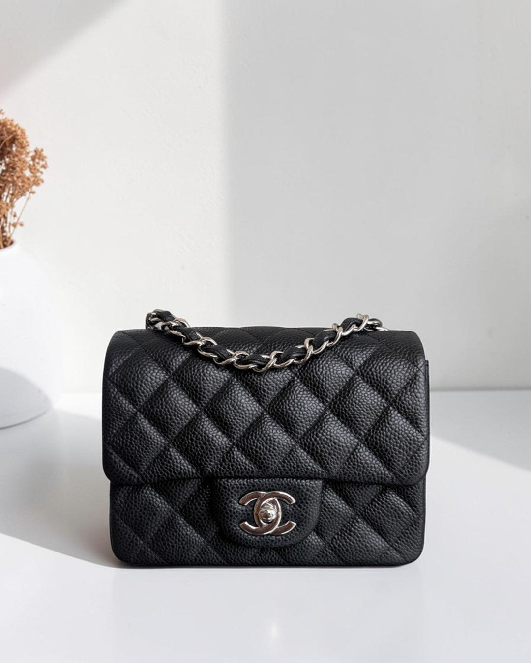 Luxury Evermore black quilted caviar leather Chanel classic flap bag with silver chain strap and CC turn-lock clasp