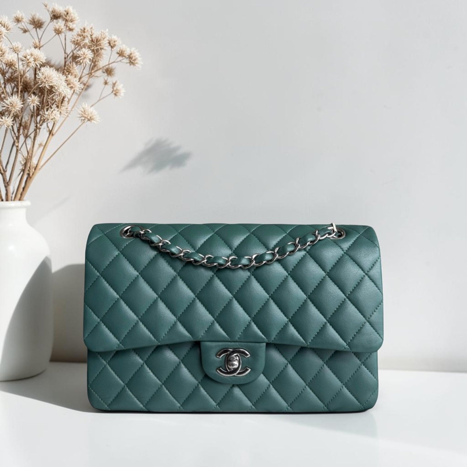 Luxury Evermore Chanel Classic Flap medium quilted lambskin bag in olive green with silver hardware.
