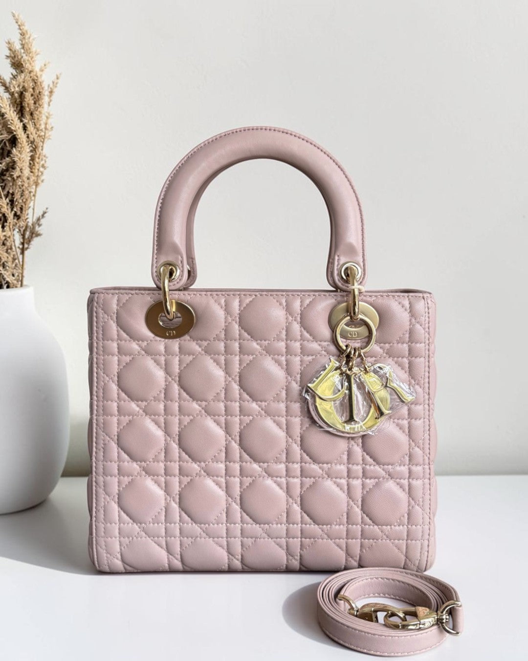 Luxury Evermore medium pink quilted leather handbag with gold-tone hardware and signature charm