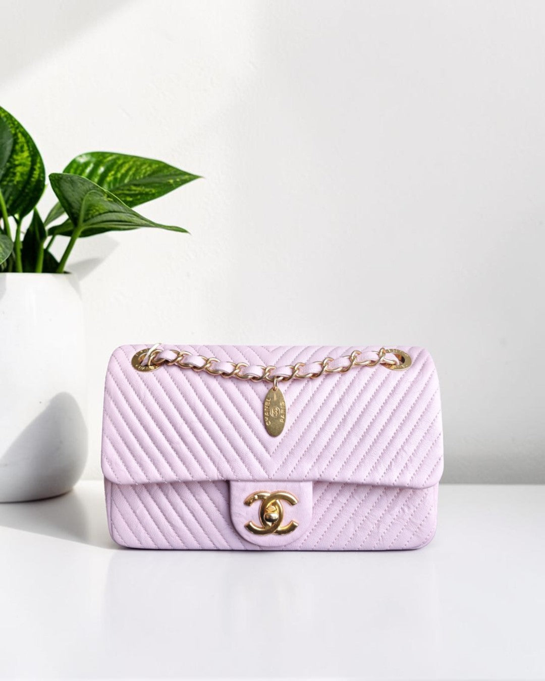 Chanel Seasonal Flap - Chevron Surpique CC Herringbone Medallion Flap Light pink Gold Hardware Series 22