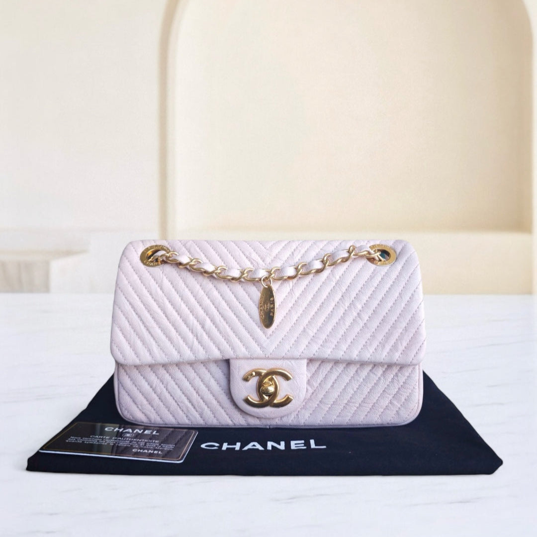 Chanel Seasonal Flap - Chevron Surpique CC Herringbone Medallion Flap Light pink Gold Hardware Series 22