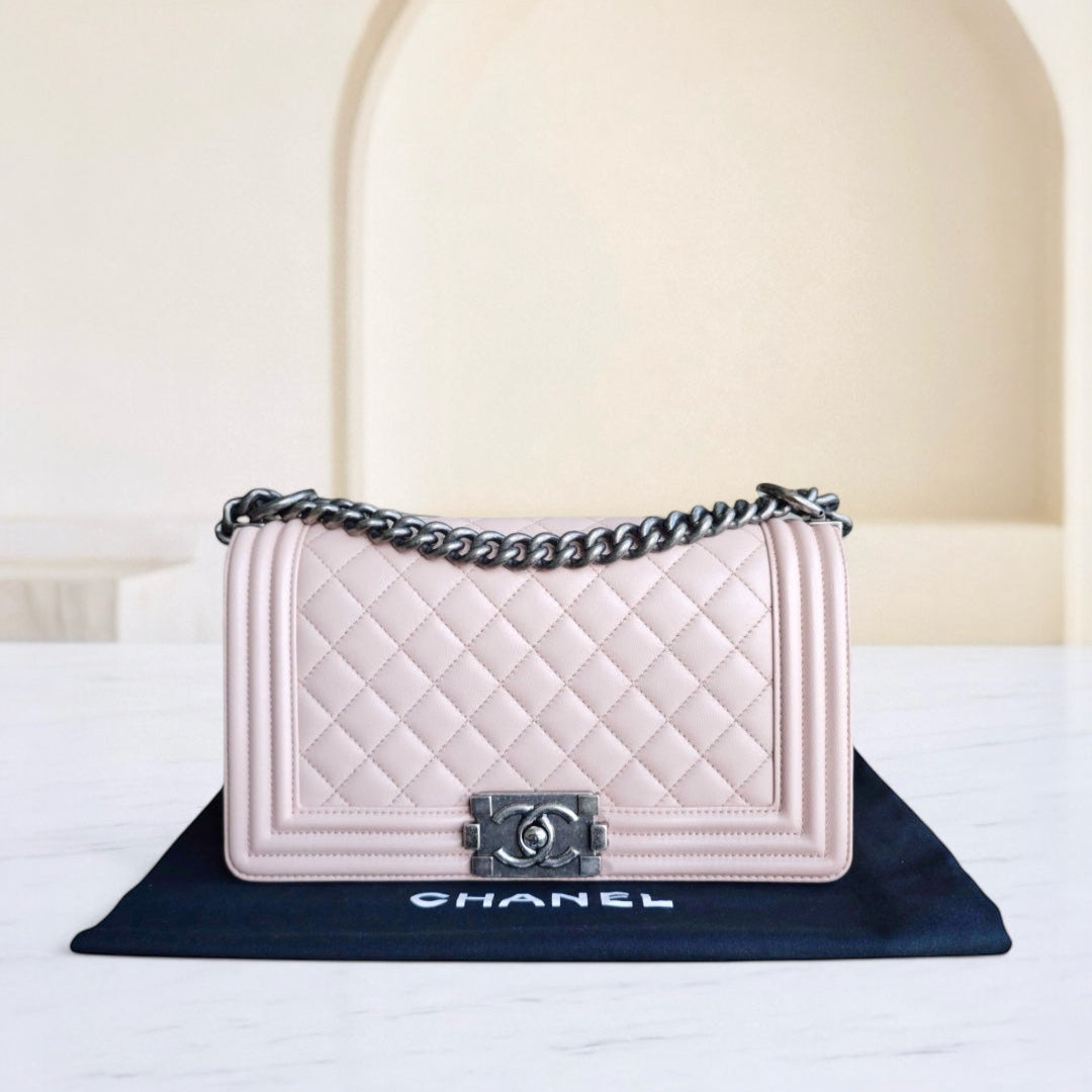 Chanel handbag on a branded mat with a neutral background