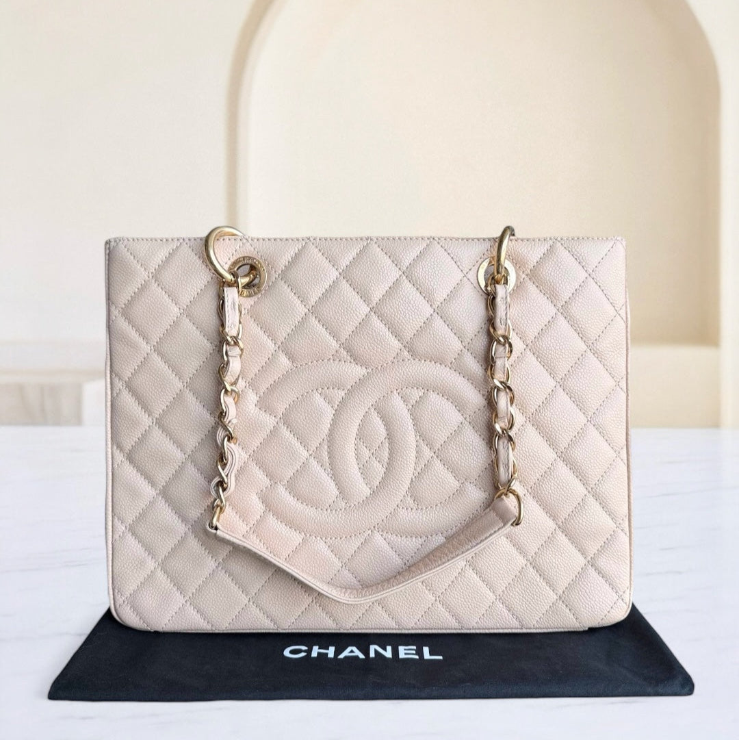 Chanel handbag with quilted design on a white background