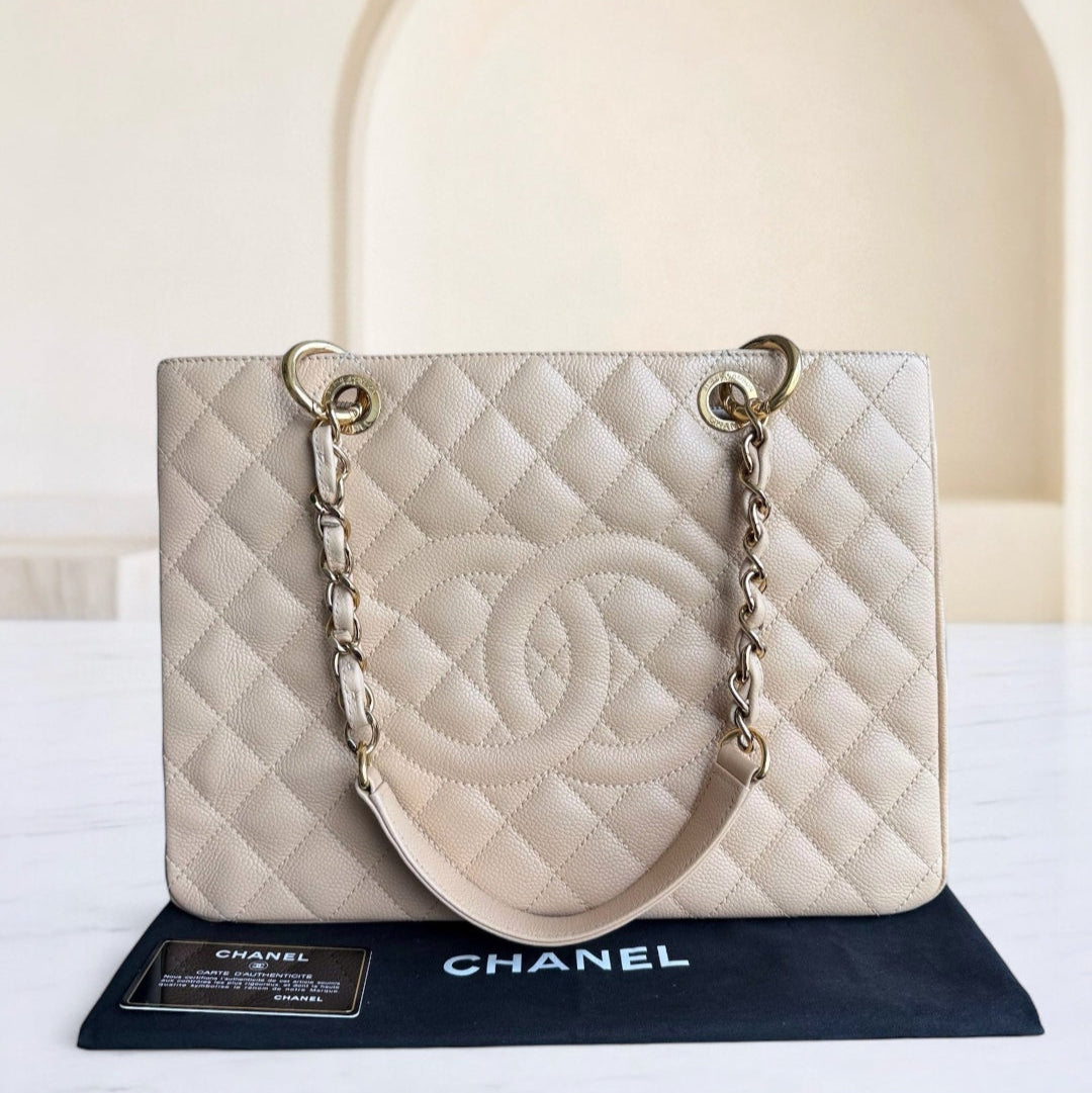 Chanel handbag on a stand with a blurred background