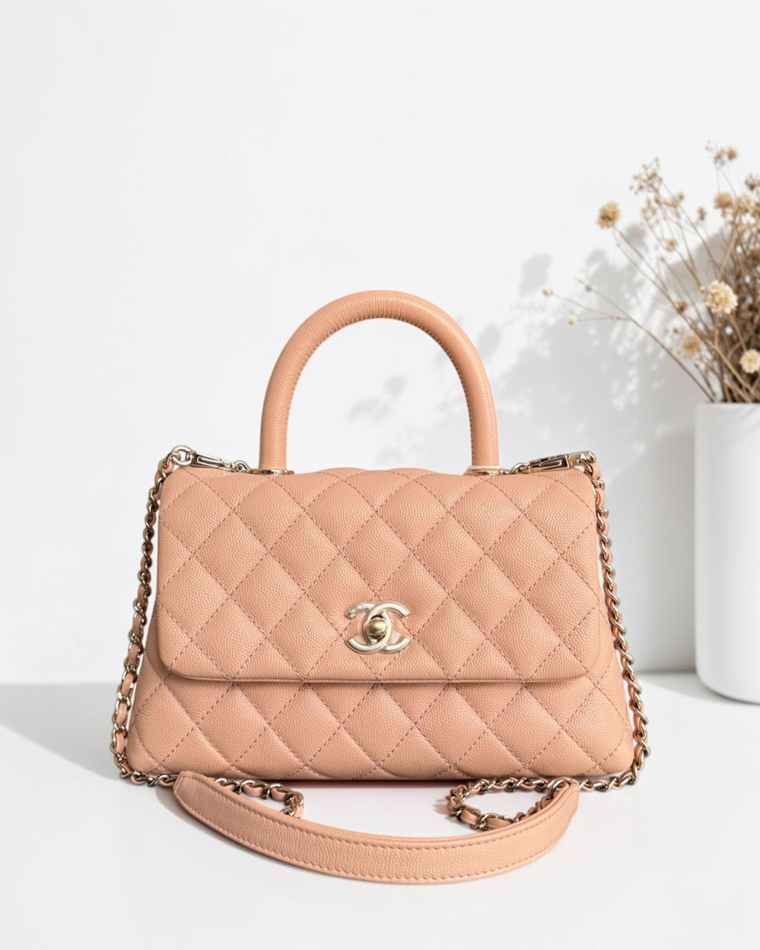 Luxury Evermore quilted blush pink caviar leather handbag with gold-tone CC logo clasp and chain shoulder strap