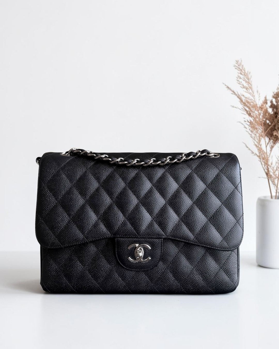 Luxury Evermore Chanel Classic Jumbo double flap bag in black quilted caviar leather with silver hardware