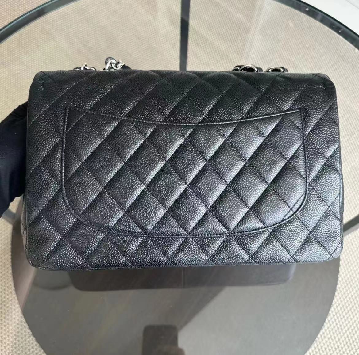 Chanel Caviar Jumbo Classic Flap Quilted Grained Calfskin Black Silver Hardware Series 12 - Luxury Evermore