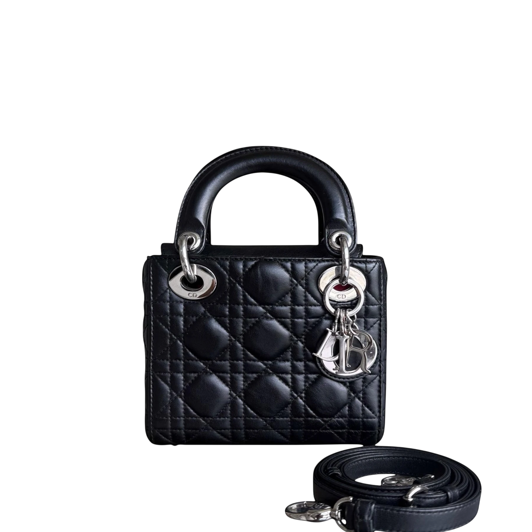 Luxury Evermore black lambskin Dior Lady Mini bag with silver hardware and adjustable strap, featuring iconic cannage stitching.