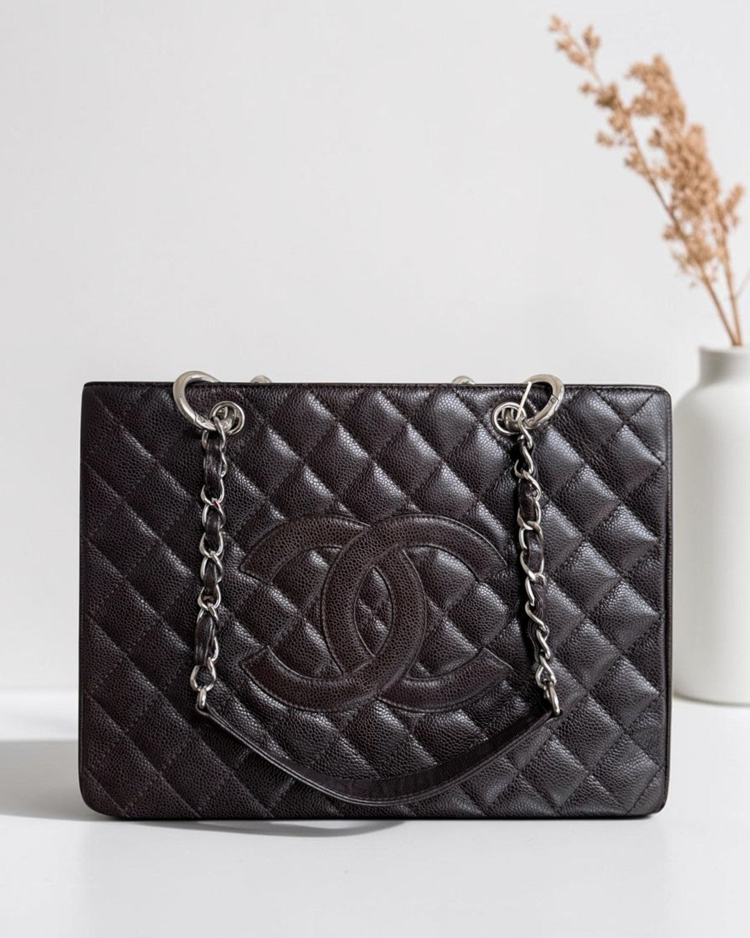 Luxury Evermore black quilted caviar leather tote bag with silver chain straps and iconic CC logo