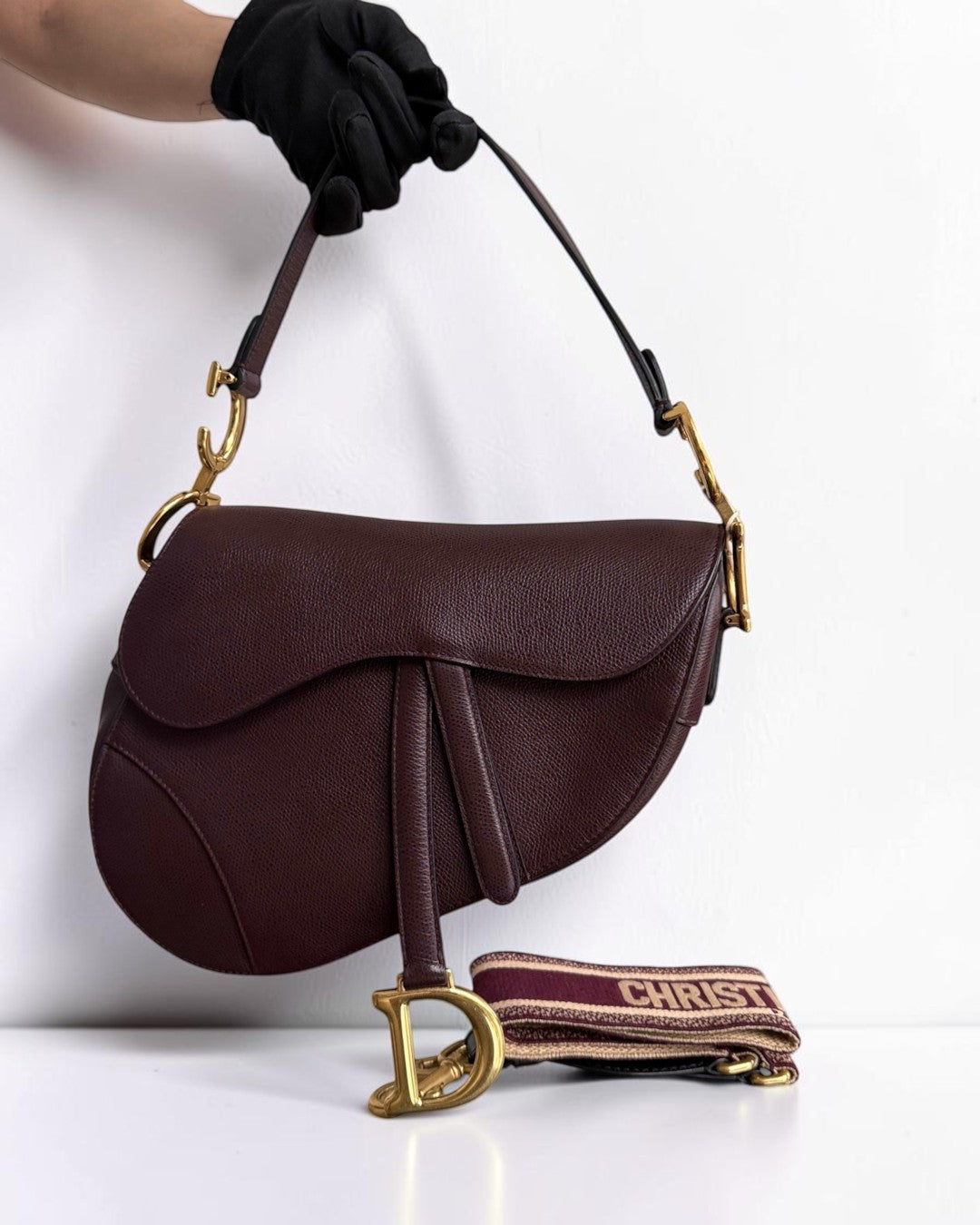 Luxury Evermore burgundy grained leather saddle bag with gold hardware and detachable embroidered shoulder strap