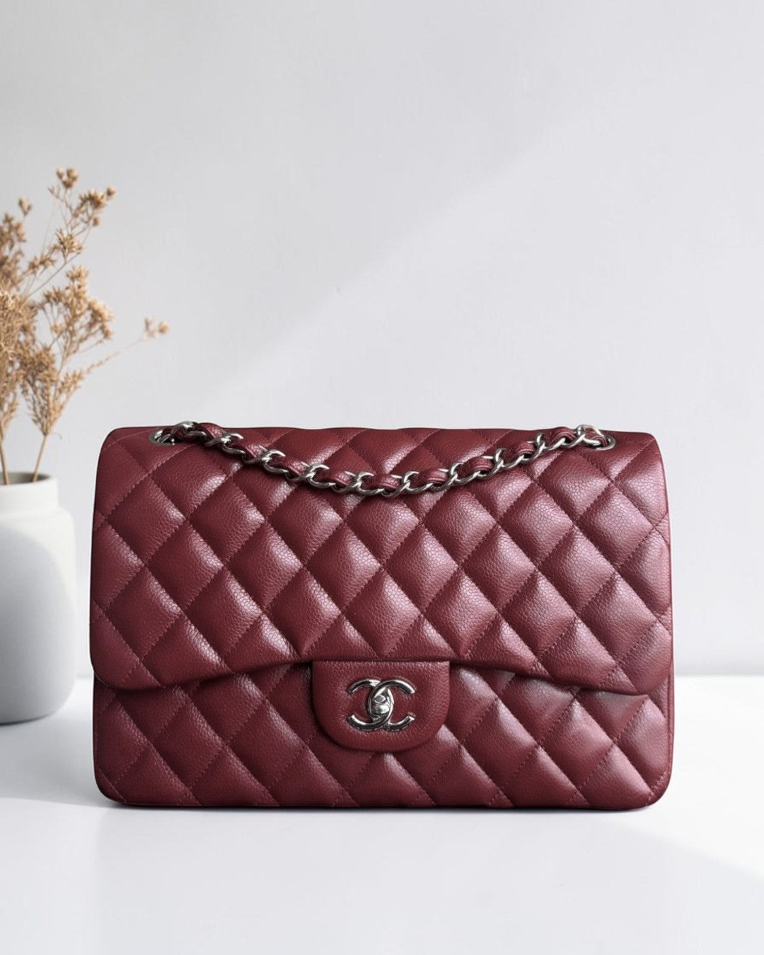 Luxury Evermore Chanel Classic Flap Jumbo in burgundy quilted caviar leather with silver hardware and chain strap