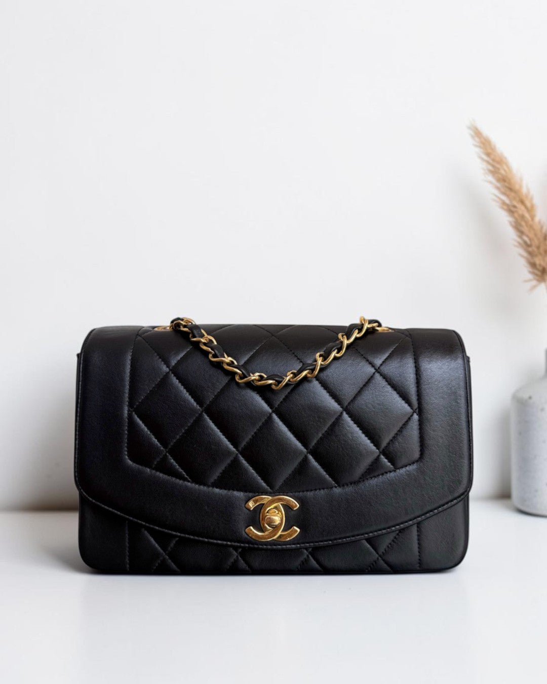 Luxury Evermore Chanel Diana small quilted black lambskin handbag with 24K gold hardware and chain strap
