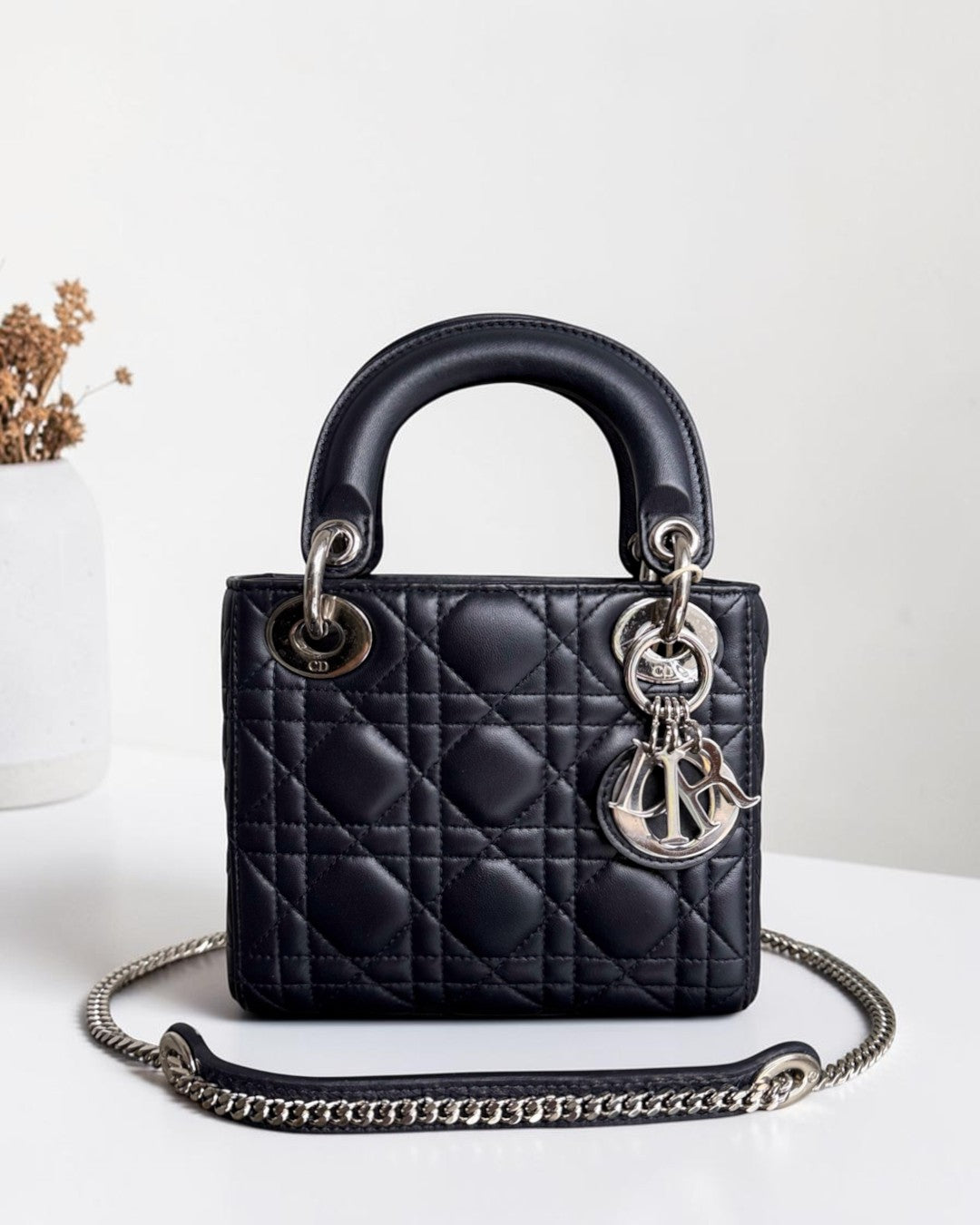 Luxury Evermore Dior Lady Mini bag in midnight blue lambskin with iconic cannage stitching and silver chain strap