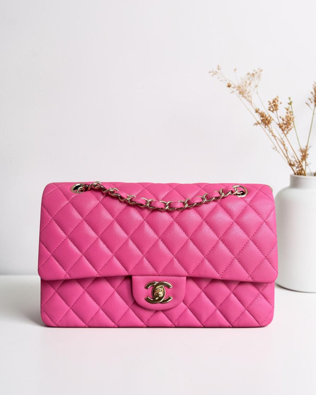 Luxury Evermore pink quilted leather classic flap bag with gold-tone chain strap and CC turn-lock closure