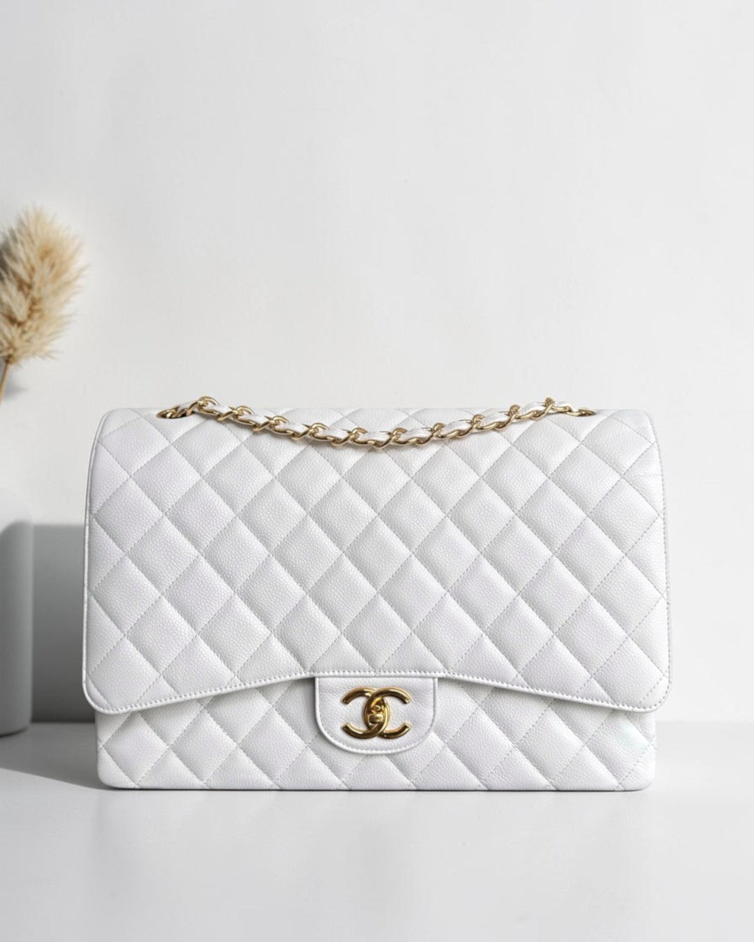 Luxury Evermore white quilted leather Maxi handbag with gold chain strap and iconic interlocking CC logo clasp