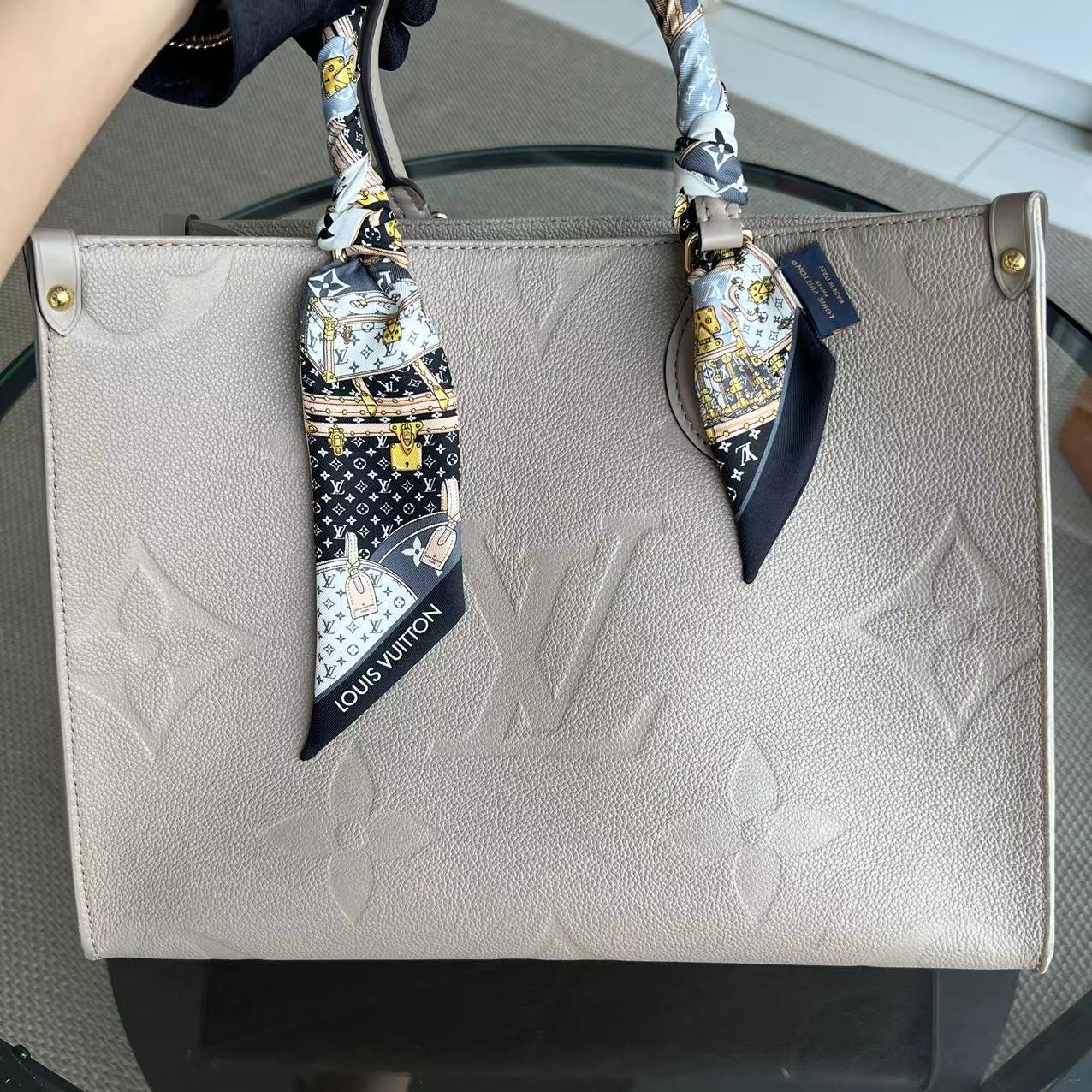 LV Louis Vuitton OnTheGo MM On The Go Monogram Empreinte Tourterelle Grey - Luxury Evermore