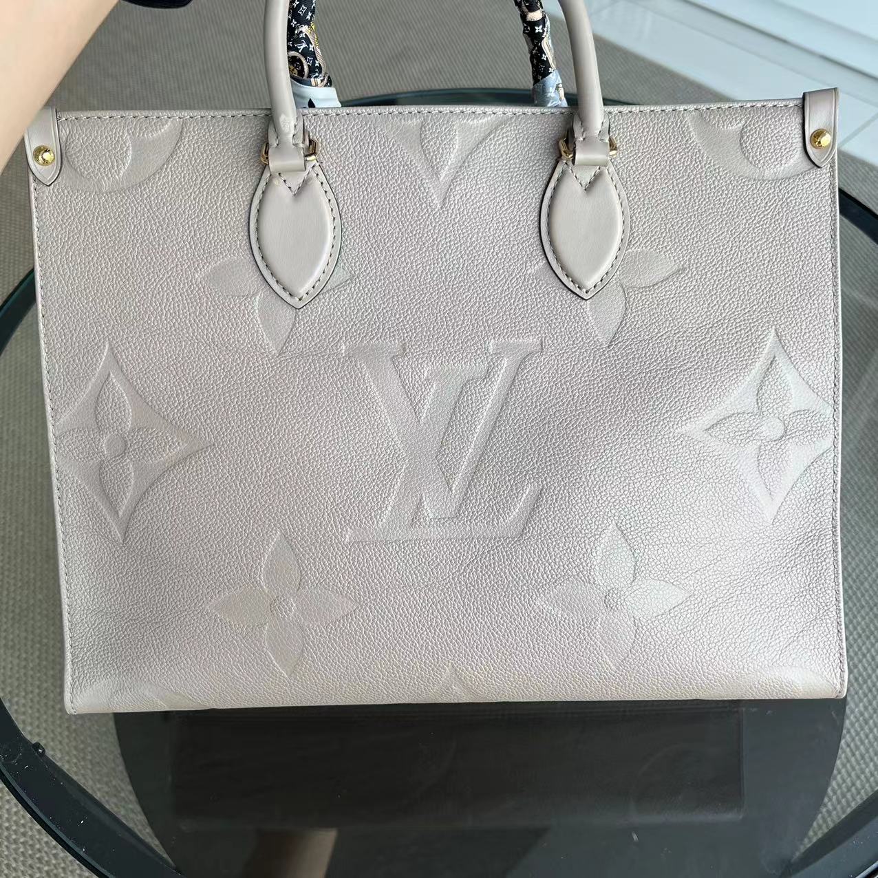 LV Louis Vuitton OnTheGo MM On The Go Monogram Empreinte Tourterelle Grey - Luxury Evermore