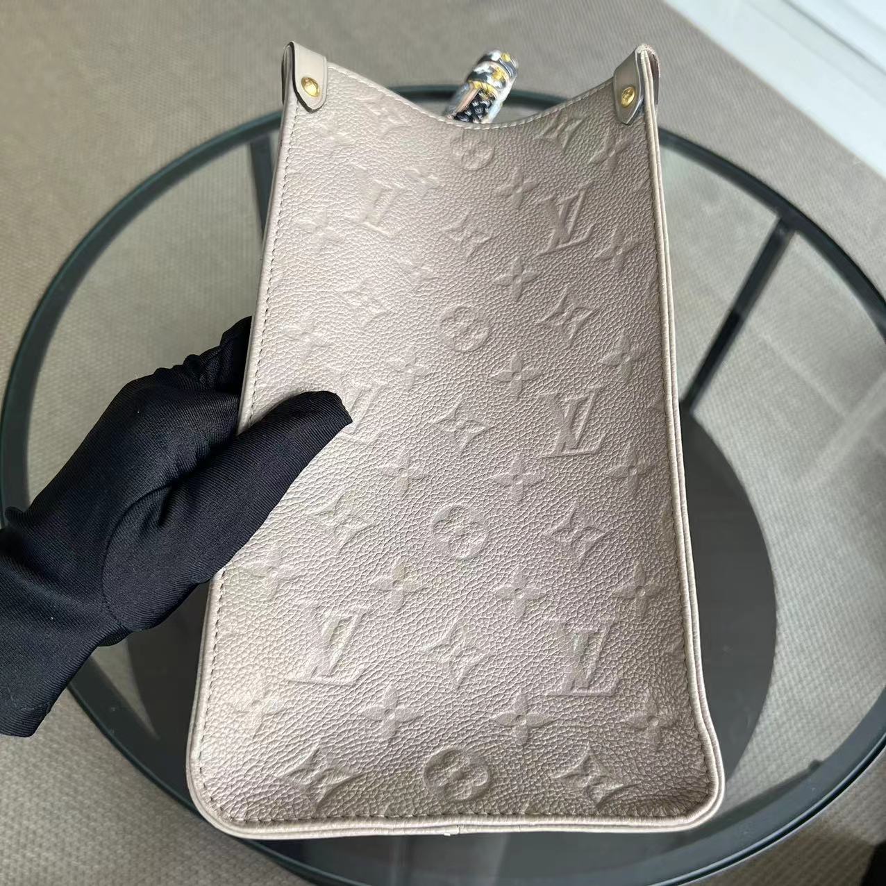 LV Louis Vuitton OnTheGo MM On The Go Monogram Empreinte Tourterelle Grey - Luxury Evermore