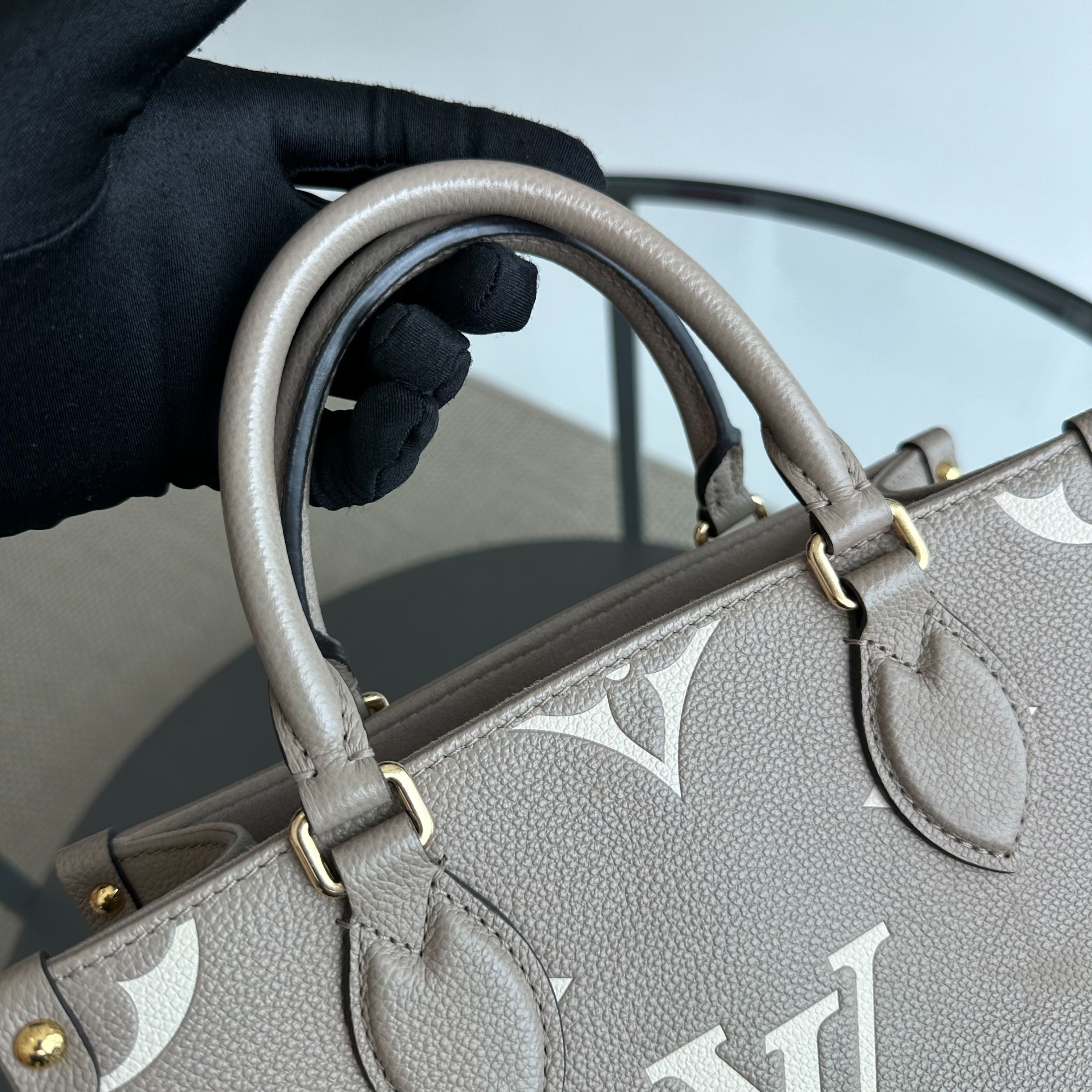 LV Louis Vuitton OnTheGo PM On The Go Empreinte Grey Cross Body Bag - Luxury Evermore